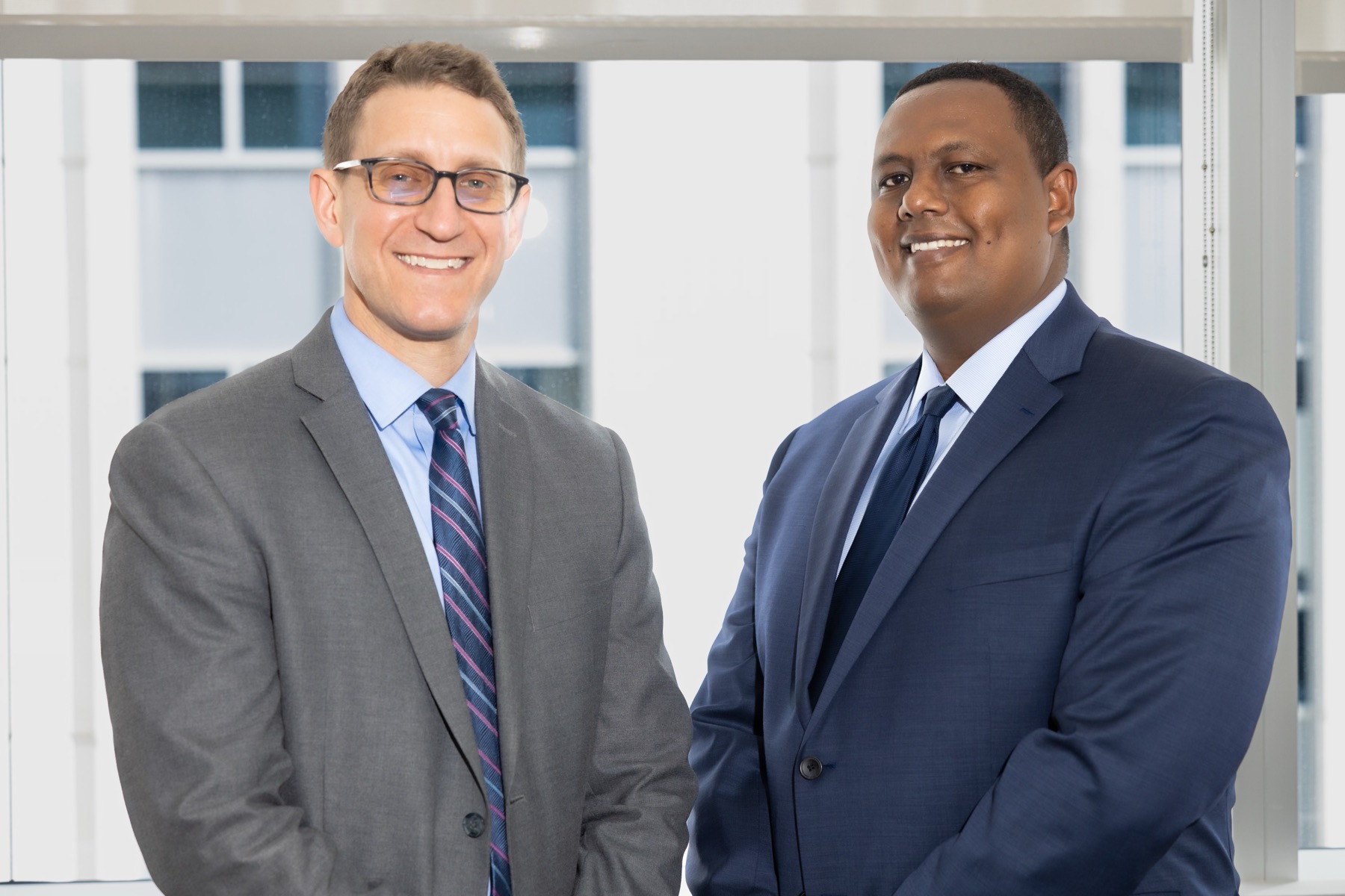 Chad Mason, Esq. and Kahn Kassegn, Esq.